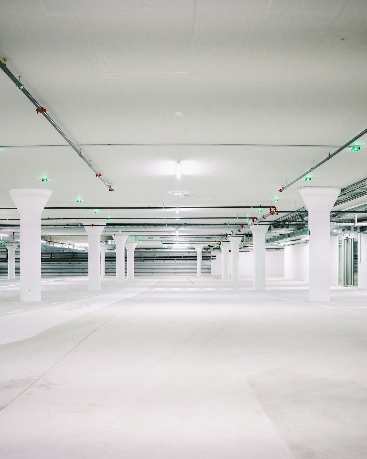 A bright, clean underground parking garage.
